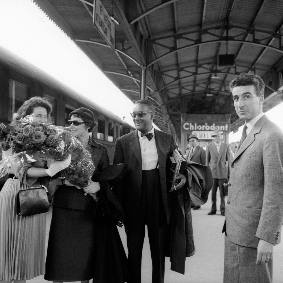 american writer richard wright and his wife ellen poplar welcomed at the rail station by some delegates of mondadori publishing house for the opening of the new factory verona, 1957 photo by emilio ronchinimondadori via getty images