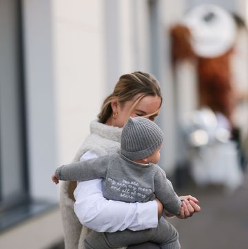 cologne, germany october 21 anna lena schulz seen wearing famvibes white cotton longsleeve, famvibes white cream fluffy teddy gilet, nadine tosun label grey wide leg suit pants baby is completely dressed in famvibes, on october 21, 2023 in cologne, germany photo by jeremy moellergetty images