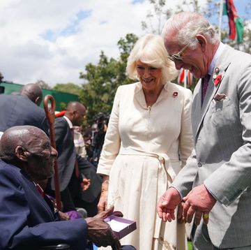 nairobi, kenya november 1 king charles iii and queen camilla meet veteran samwel nthigai mburia, who is believed to be 117 years old, during a visit to the commonwealth war graves commission cemetery in nairobi, joining british and kenyan military personnel in an act of remembrance, on day two of the state visit to kenya on november 1, 2023 in nairobi, kenya king charles iii and queen camilla are visiting kenya for four days at the invitation of kenyan president william ruto, to celebrate the relationship between the two countries the visit comes as kenya prepares to commemorate 60 years of independence photo by pool victoria jonesgetty images