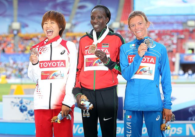 moscow, russia august 10 r l silver medalist valeria straneo of italy, gold medalist edna ngeringwony kiplagat of kenya and bronze medalist kayoko fukushi of japan stand on the podium during the medal ceremony for the womens marathon during day one of the 14th iaaf world athletics championships moscow 2013 at luzhniki stadium on august 10, 2013 in moscow, russia photo by christian petersengetty images