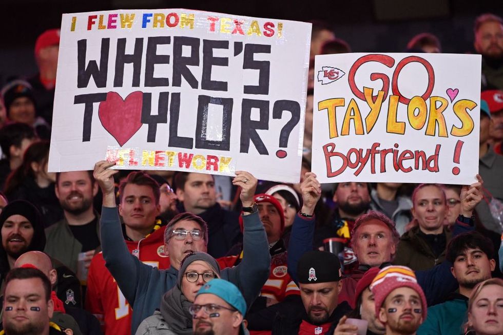 fans hold up placards referring to taylor swifts boyfriend kansas city chiefs tight end travis kelce during the nfl game between miami dolphins and kansas city chiefs at the waldstadion in frankfurt am main, western germany on november 5, 2023 kansas city chiefs won the match 2114 photo by kirill kudryavtsev afp photo by kirill kudryavtsevafp via getty images