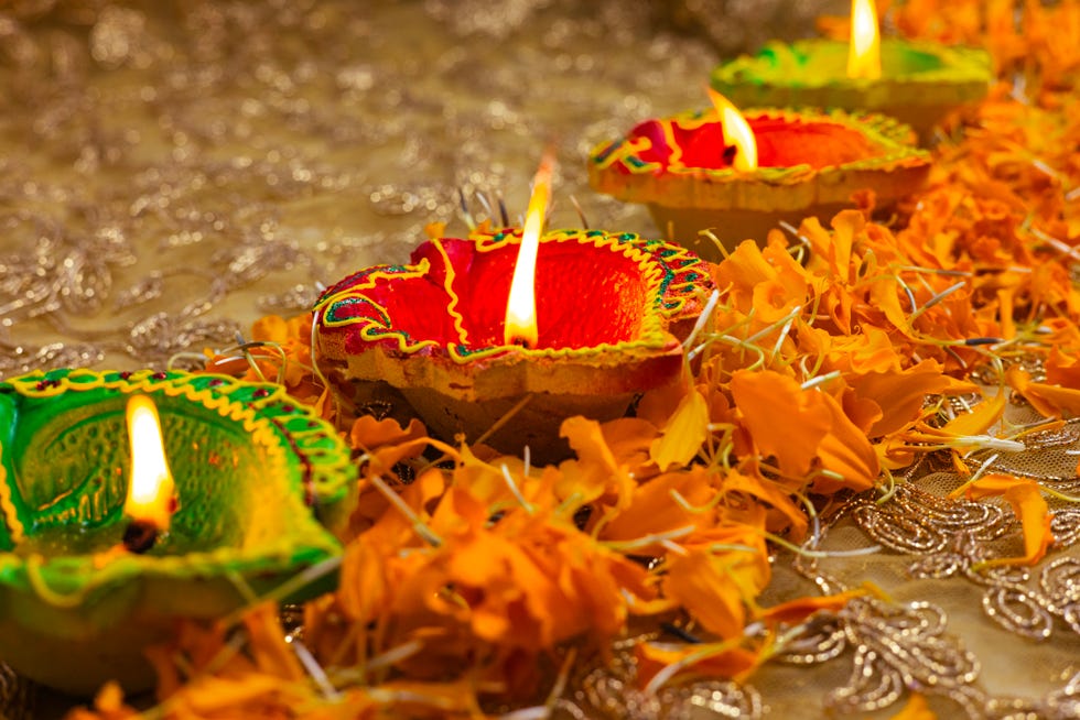 decorated colorful clay diya oil lamp and flowers, diwali is popular indian hindu festival it is called the festival of lights, it is also known as deepawali