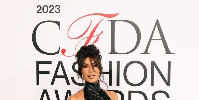 Kim Kardashian Wears Diamond 'Saint' Necklace With Skintight Bodysuit