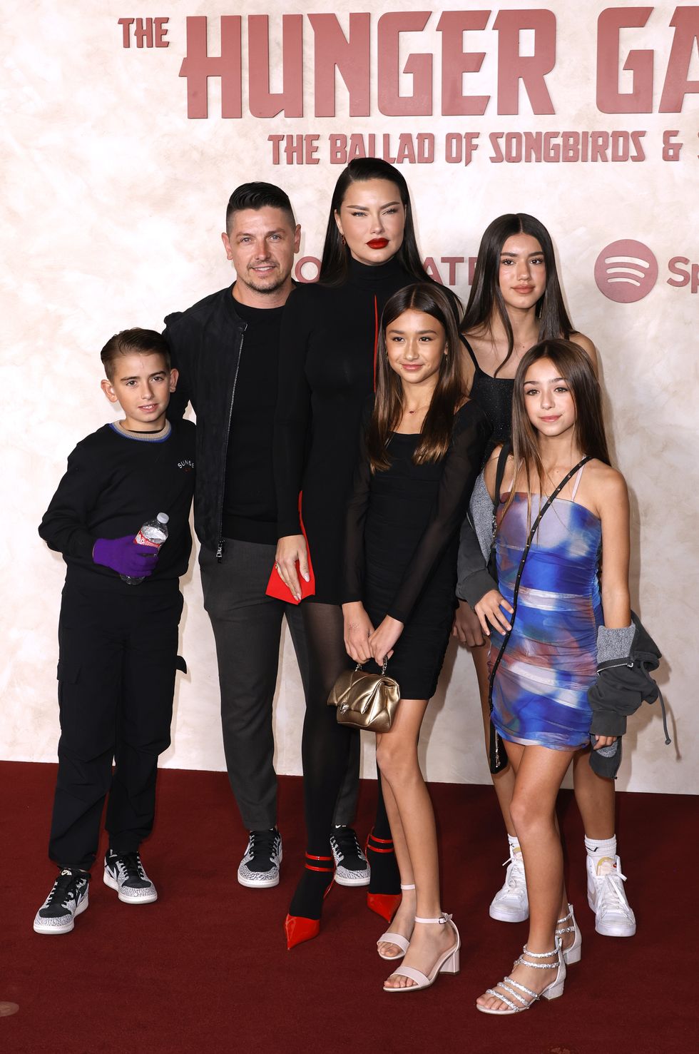 hollywood, california november 13 andre lemmers, adriana lima and family attend the hunger games the ballad of songbirds snakes los angeles premiere at tcl chinese theatre on november 13, 2023 in hollywood, california photo by frazer harrisongetty images