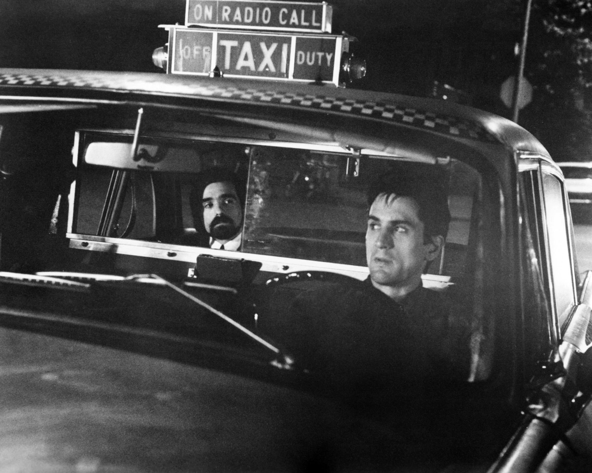 director martin scorsese left as the silhouette watching passenger, and robert de niro as travis bickle in taxi driver, directed by scorsese, 1976 photo by silver screen collectiongetty images