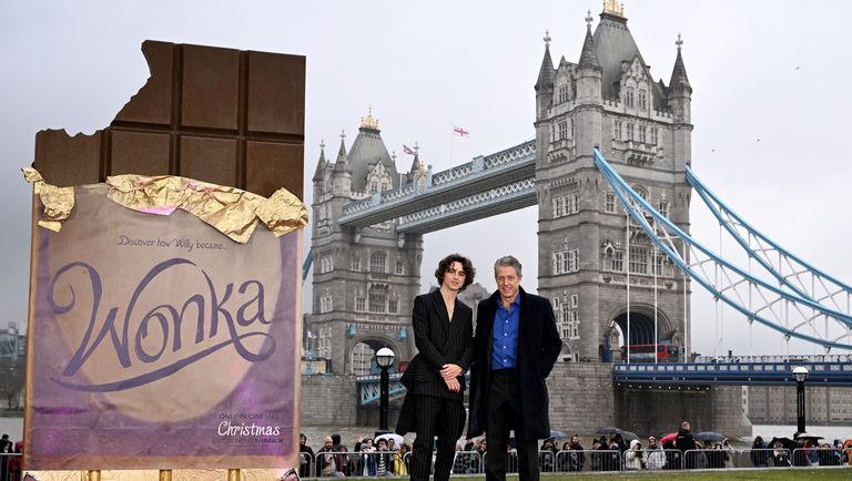london, england november 27 l r timothee chalamet and hugh grant attend the wonka photocall at potters field park on november 27, 2023 in london, england photo by jeff spicergetty images for warner bros