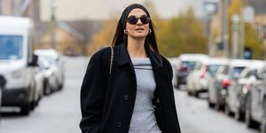 berlin, germany november 27 anna winter wears grey knitted dress edited heels prada, black oversized coat frankie shop, sunglasses moncler, tights, hair band on november 27, 2023 in berlin, germany photo by christian vieriggetty images