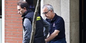 a member of the guardia civil escorts journalist alfonso basterra while spanish detectives search his home in santiago de compostela on september 26, 2013 as they probed the suspected killing of her adopted chinese born, 12 year old daughter police said they had detained rosario porto, 44, and journalist alfonso basterra, 49, on suspicion of homicide after their daughters body was found at 130 am september 22 in woodland near the northwestern city of santiago de compostela according to spanish media reports, a couple heading to a nightclub discovered the body of the girl, asunta yong fang basterra porto, just hours after she had been reported missing by her parents afp photo oscar corral photo credit should read oscar corralafp via getty images