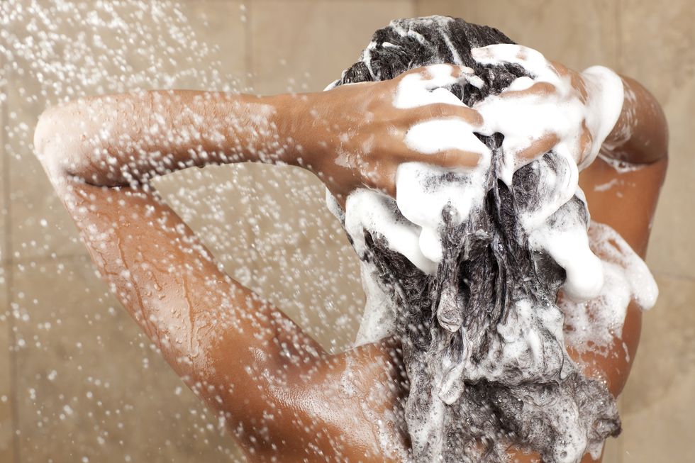 woman washing her hair with shampoo, rear viewsimilar images preview