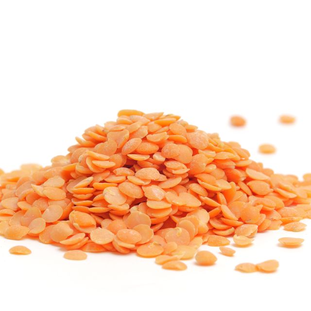a small heap of uncooked red lentils