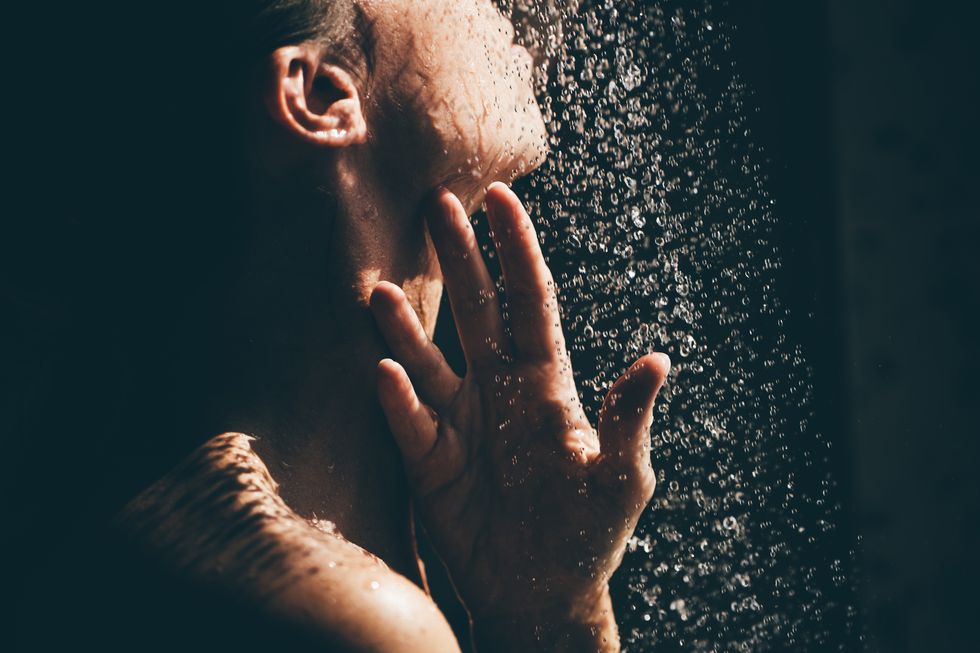 woman taking a shower close up