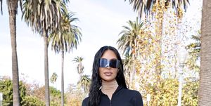 a person wearing sunglasses and a black jacket