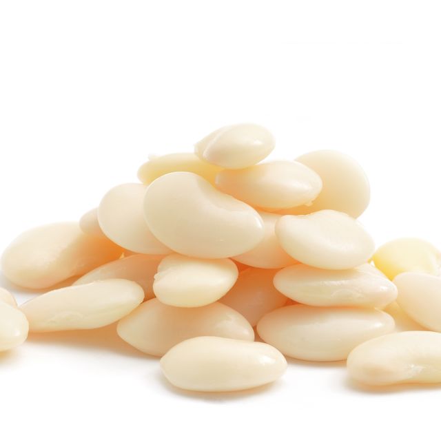 a close up shot of a pile of butter beans isolated on white