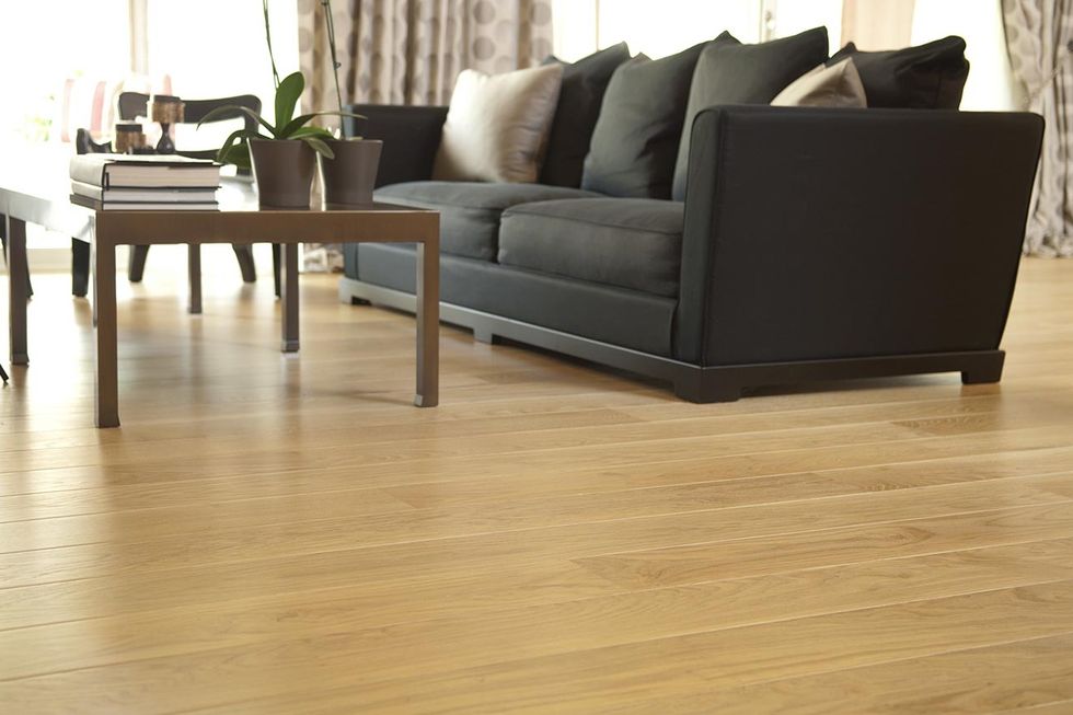 a living room with oak flooring