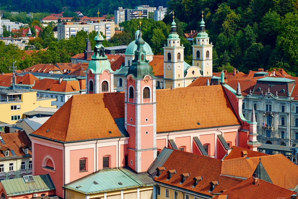 slovenia, ljubljana, cityscape with franciscan church, saint nicholas church and the castle