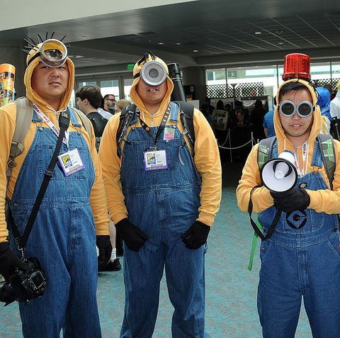 cosplayers dressed in yellow sweatshirts and overalls as minions from despicable me attend comic con international