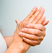woman holding handwrist out of pain