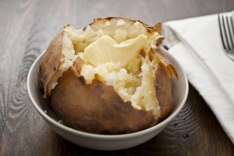 baked potato with melting butter, horizontal