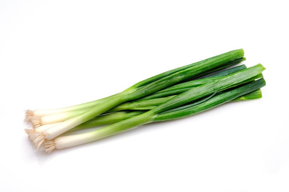green onion on white background.