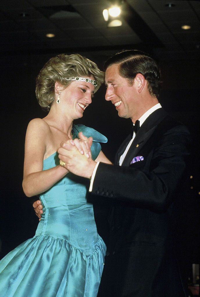 melbourne, australia   october 31 prince charles, prince of wales and diana, princess of wales, wearing a green satin evening dress designed by david and elizabeth emanuel and an emerald necklace as a headband, dance together during a gala dinner dance at the southern cross hotel on october 31, 1985 in melbourne, australia photo by anwar husseingetty images