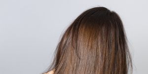 long hair from behind isolated on gray background