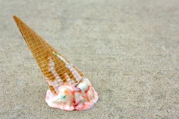 Shell, Conch, Conch, Sea snail, Ice cream cone, Natural material, Musical instrument, Sand, Shankha, Animal product, 