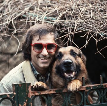 italian singer songwriter and guitarist ivan graziani smiling with his dog 1979 photo by angelo deligiomondadori via getty images