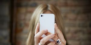 woman taking selfie with cell phone