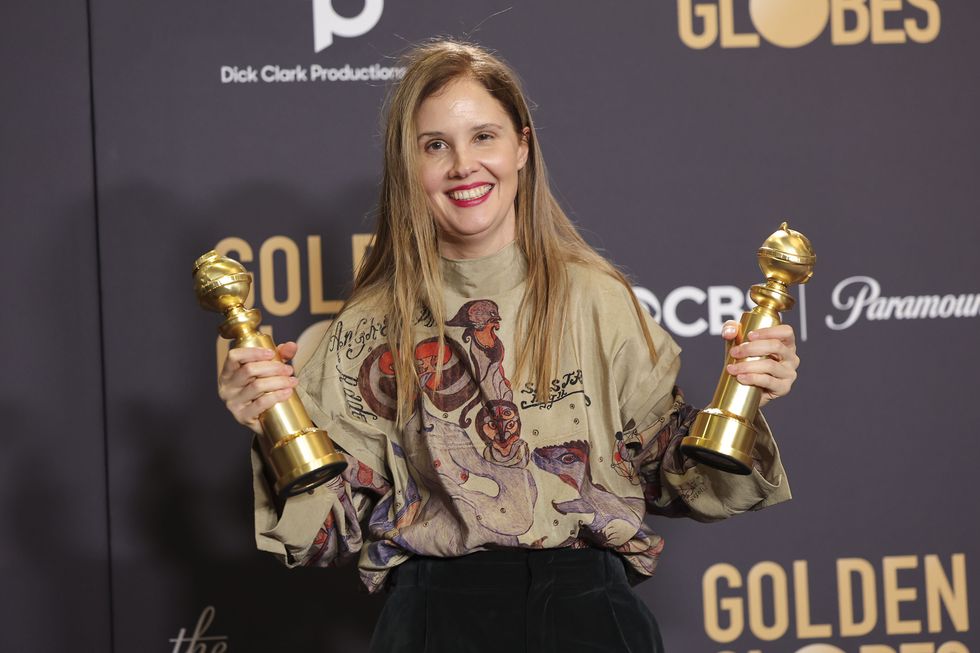 justine triet poses with the award for best screenplay motion picture for anatomy of a fall at the 81st golden globe awards held at the beverly hilton hotel on january 7, 2024 in beverly hills, california photo by john salangsanggolden globes 2024golden globes 2024 via getty images