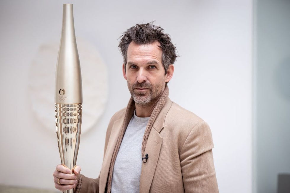 french designer of the 2024 olympic torch, mathieu lehanneur, poses with the torch in his workshop la factory in ivry sur seine, on january 9, 2024 photo by bertrand guay afp photo by bertrand guayafp via getty images