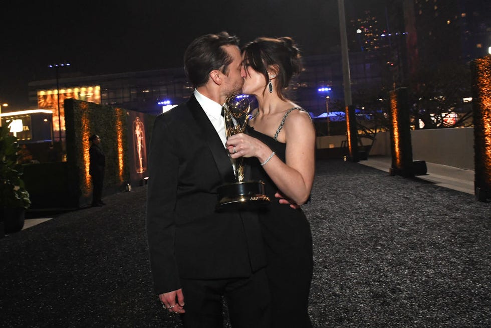 us actor kieran culkin, with his award for outstanding lead actor in a drama series for succession, kisses wife jazz charton as they attend the 75th emmy awards governors gala at the los angeles convention center in los angeles on january 15, 2024 photo by valerie macon afp photo by valerie maconafp via getty images