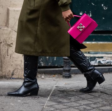 paris, france january 21 a guest wears purple bag, black cowboy boots outside wooyoungmi during the menswear fallwinter 20242025 as part of paris fashion week on january 21, 2024 in paris, france photo by christian vieriggetty images