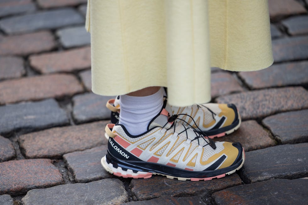 Copenhagen, Denmark, January 29, 2024 A guest wears Salomon sneakers outside Niklas Skovgaard during the AW24 Copenhagen Fashion Week on January 29, 2024 in Copenhagen, Denmark. Photo by Christian Vierighetti Images