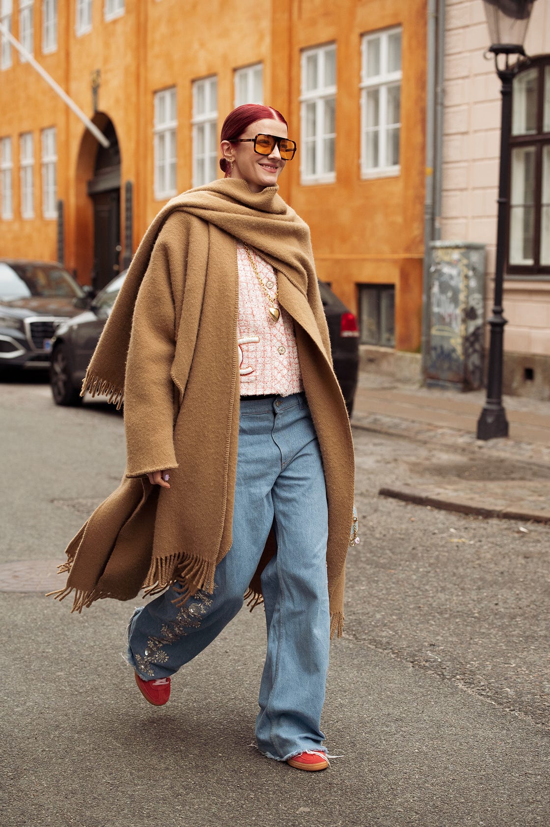 copenhagen, denmark january 30 marianne theodorsen wears wide jeans, a brown coat, and orange sunglasses outside lovechild 1979 during the copenhagen fashion week aw24 on january 30, 2024 in copenhagen, denmark photo by raimonda kulikauskienegetty images