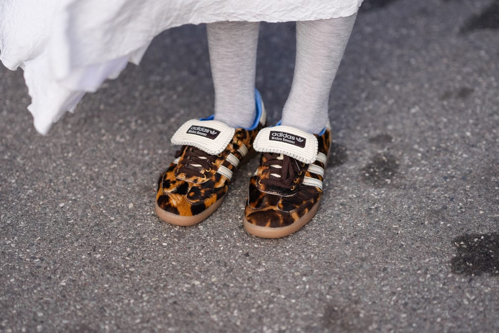 COPENHAGEN, DENMARK, FEBRUARY 1, 2024: Close up detailed view of Adidas brown leopard print sneaker shoes outdoors during Copenhagen Fashion Week AW24 in Copenhagen, Denmark