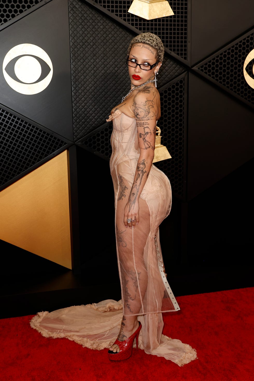 los angeles, california february 04 for editorial use only editors note image contains partial nudity doja cat attends the 66th grammy awards at cryptocom arena on february 04, 2024 in los angeles, california photo by frazer harrisongetty images