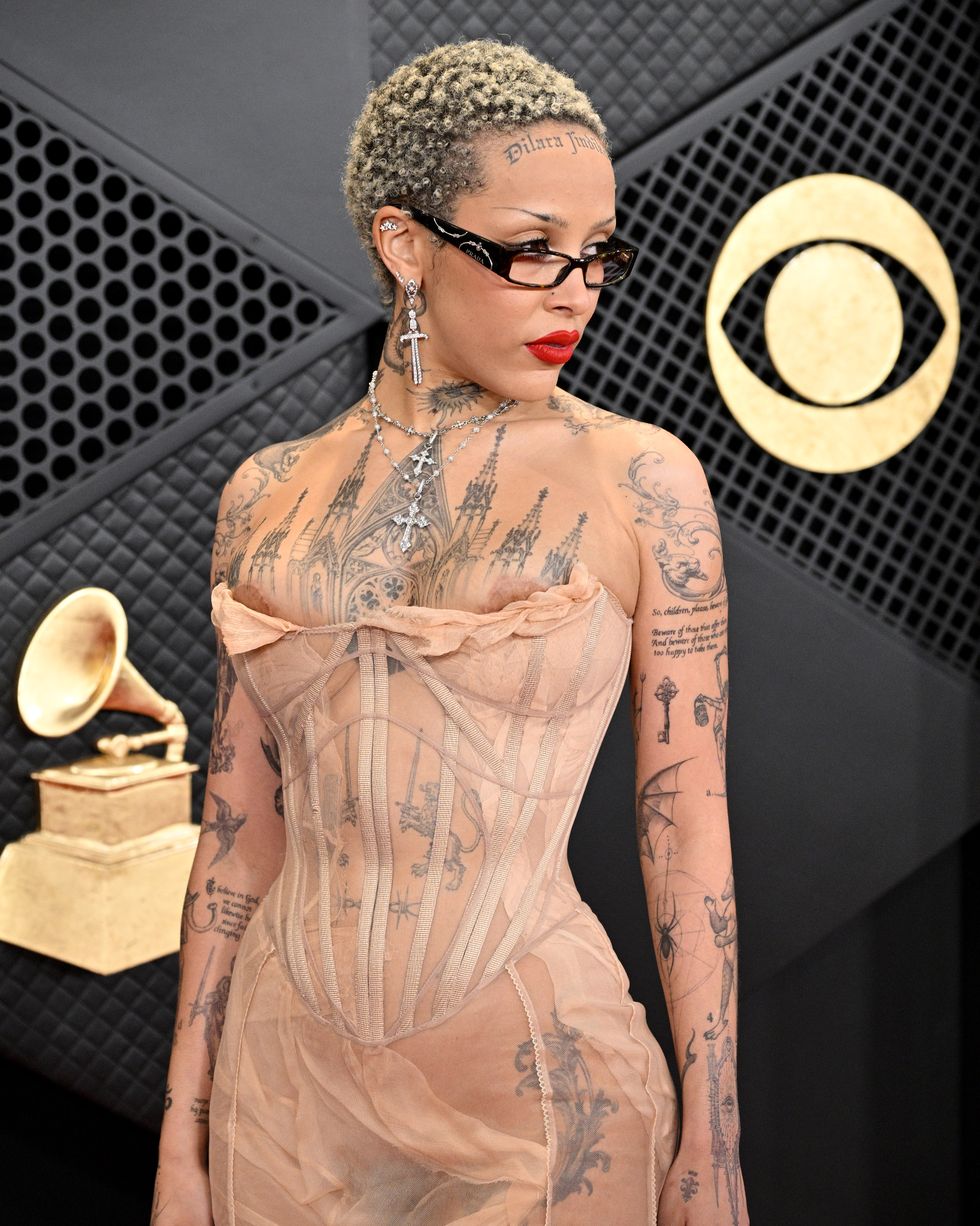 los angeles, california february 04 for editorial use only editors note image contains partial nudity doja cat attends the 66th grammy awards at cryptocom arena on february 04, 2024 in los angeles, california photo by lionel hahngetty images