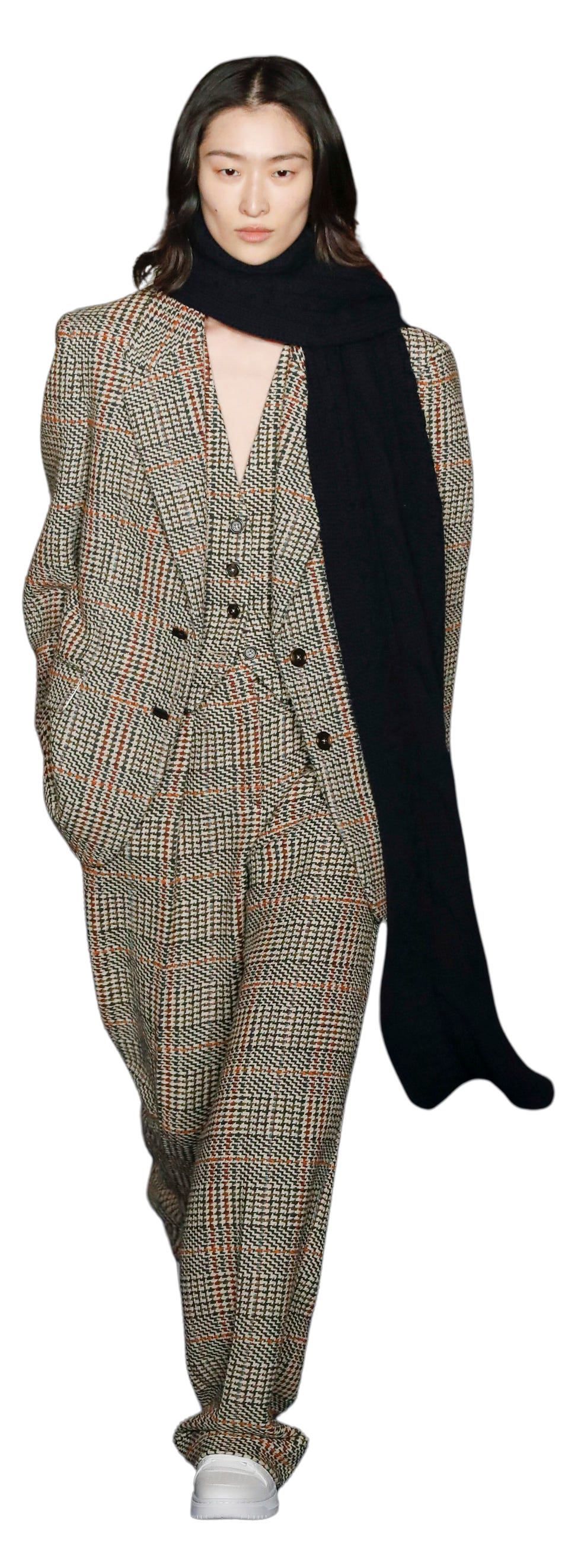 a model walks the runway during the tommy hilfiger ready to wear fall winter 2024 2024 fashion show in a tweed suit