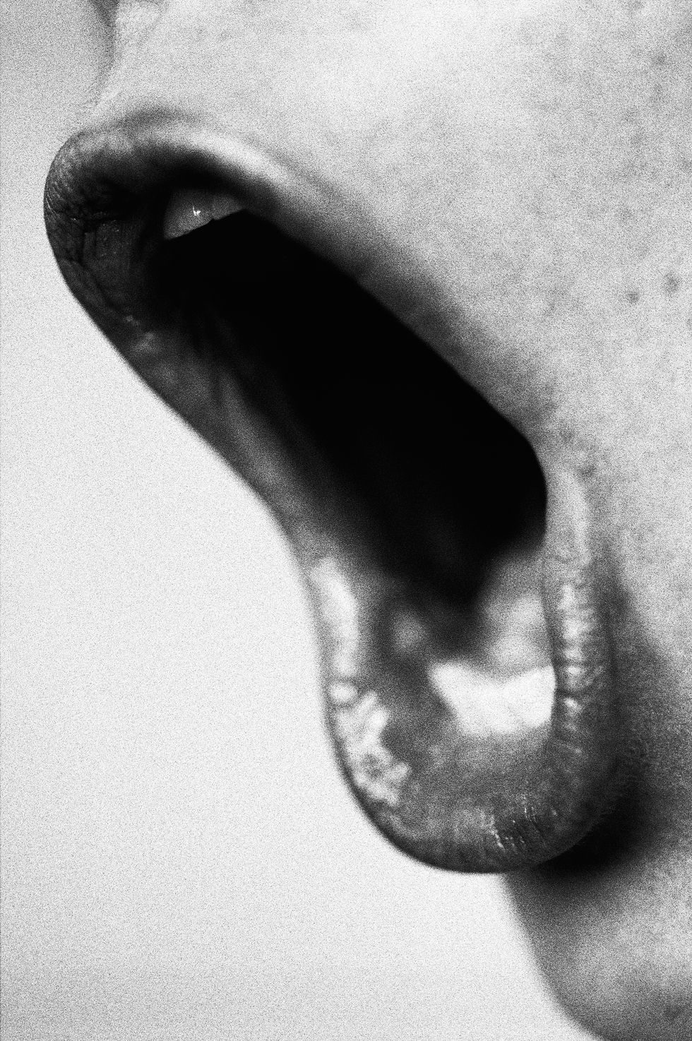 Woman shouting, close-up of mouth