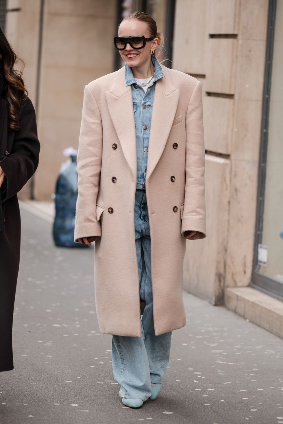 paris, france february 28 alexandra carl wears light pink coat, denim jacket, light blue jeans, sunglasses, outside dries van noten, during the womenswear fallwinter 20242025 as part of paris fashion week on february 28, 2024 in paris, france photo by claudio laveniagetty images