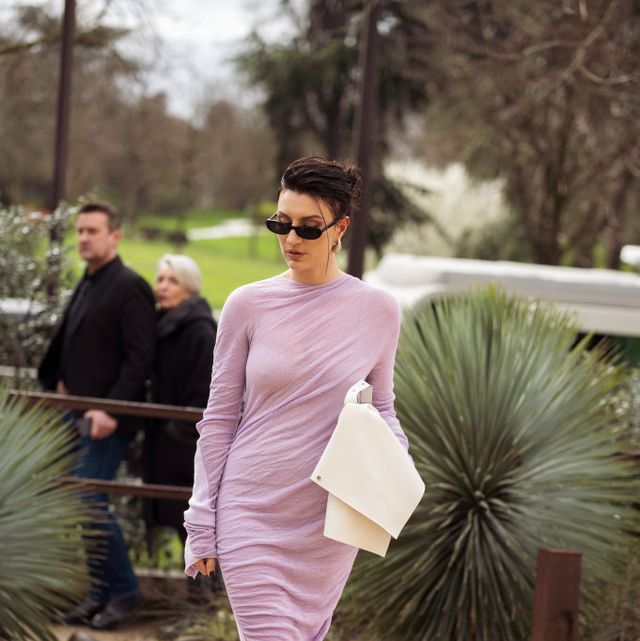 paris, france march 01 a guest wears long pale purple maxi dress, white bag, sunglasses and flat shoes decorated with crystals outside issey miyake during the womenswear fallwinter 20242025 as part of paris fashion week on march 01, 2024 in paris, france photo by raimonda kulikauskienegetty images