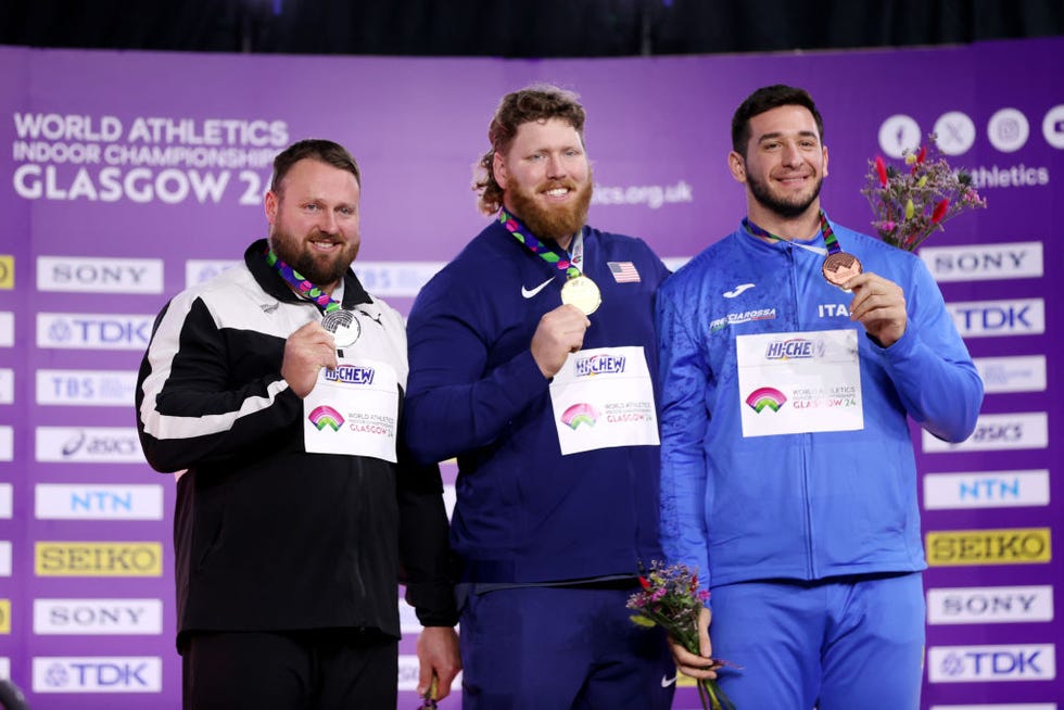 glasgow, scotland march 02 l r silver medalist tom walsh of team new zealand, gold medalist ryan crouser of team united states and bronze medalist leonardo fabbri of team italy pose for a photo during the medal ceremony for mens shot put final on day two of the world athletics indoor championships glasgow 2024 at emirates arena on march 02, 2024 in glasgow, scotland photo by alex pantlinggetty images