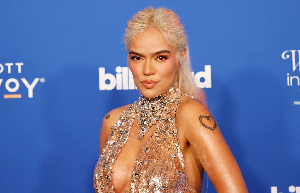 Karol G Wears Sheer Crystal Gown To Accept Woman Of The Year Award