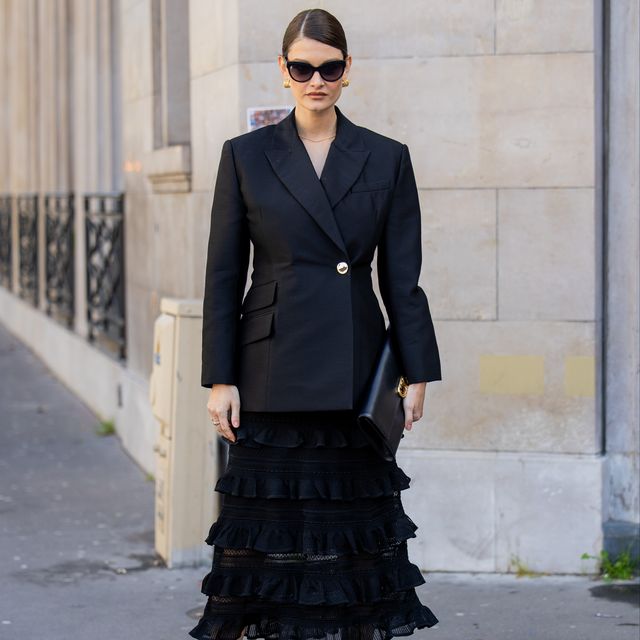 paris, france march 04 hanneli mustaparta wears black tailored blazer, black ruffled skirt, long bag, heeled sandals with flower, sunglasses outside zimmermann during the womenswear fallwinter 20242025 as part of paris fashion week on march 04, 2024 in paris, france photo by christian vieriggetty images