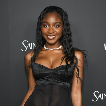 normani fishnet top and latex skirt