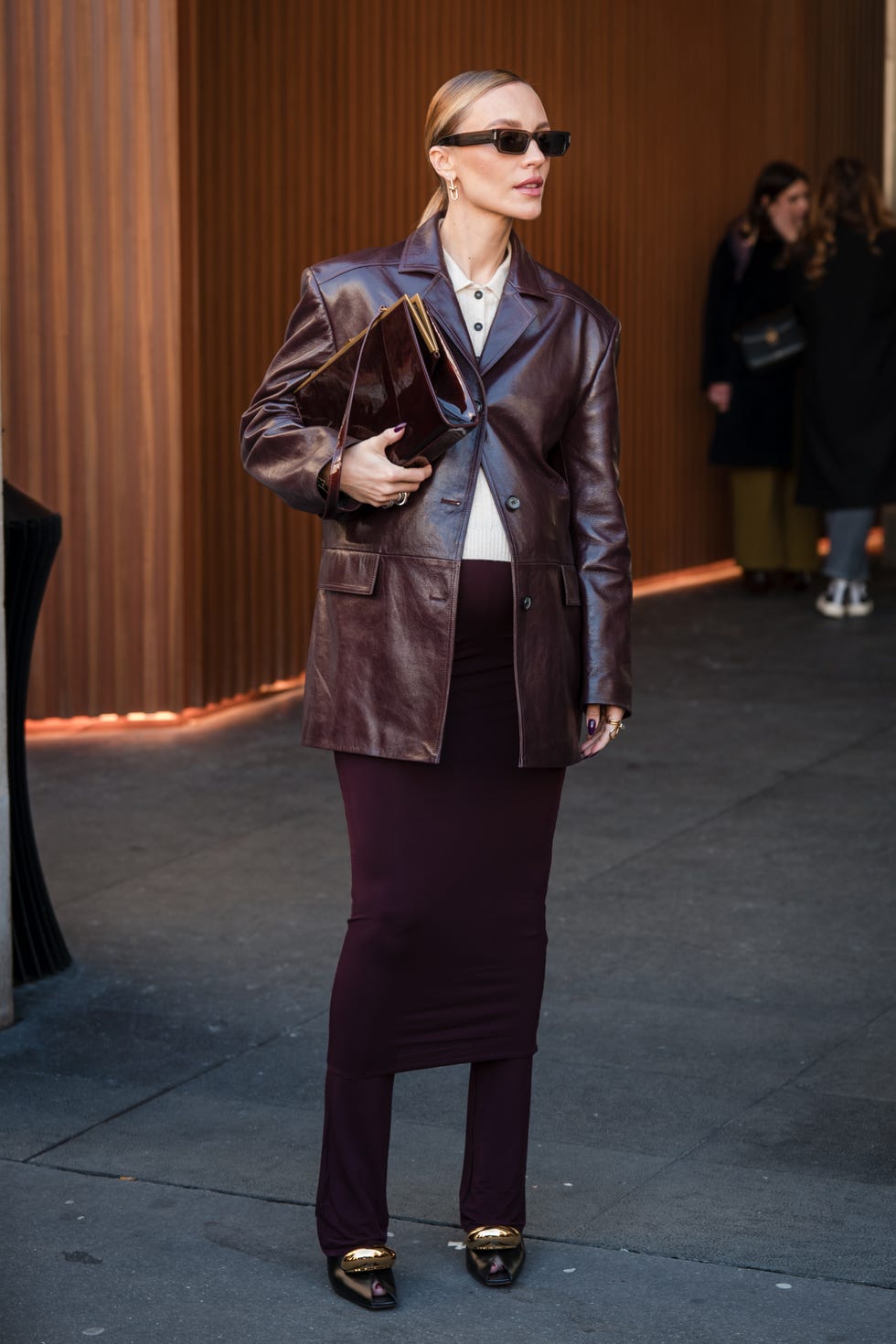 paris, france march 04 viky rader wears beige polo neck , brown leather blazer, brown skirt over pants, black heels with gold details, outside zimmermann, during the womenswear fallwinter 20242025 as part of paris fashion week on march 04, 2024 in paris, france photo by claudio laveniagetty images