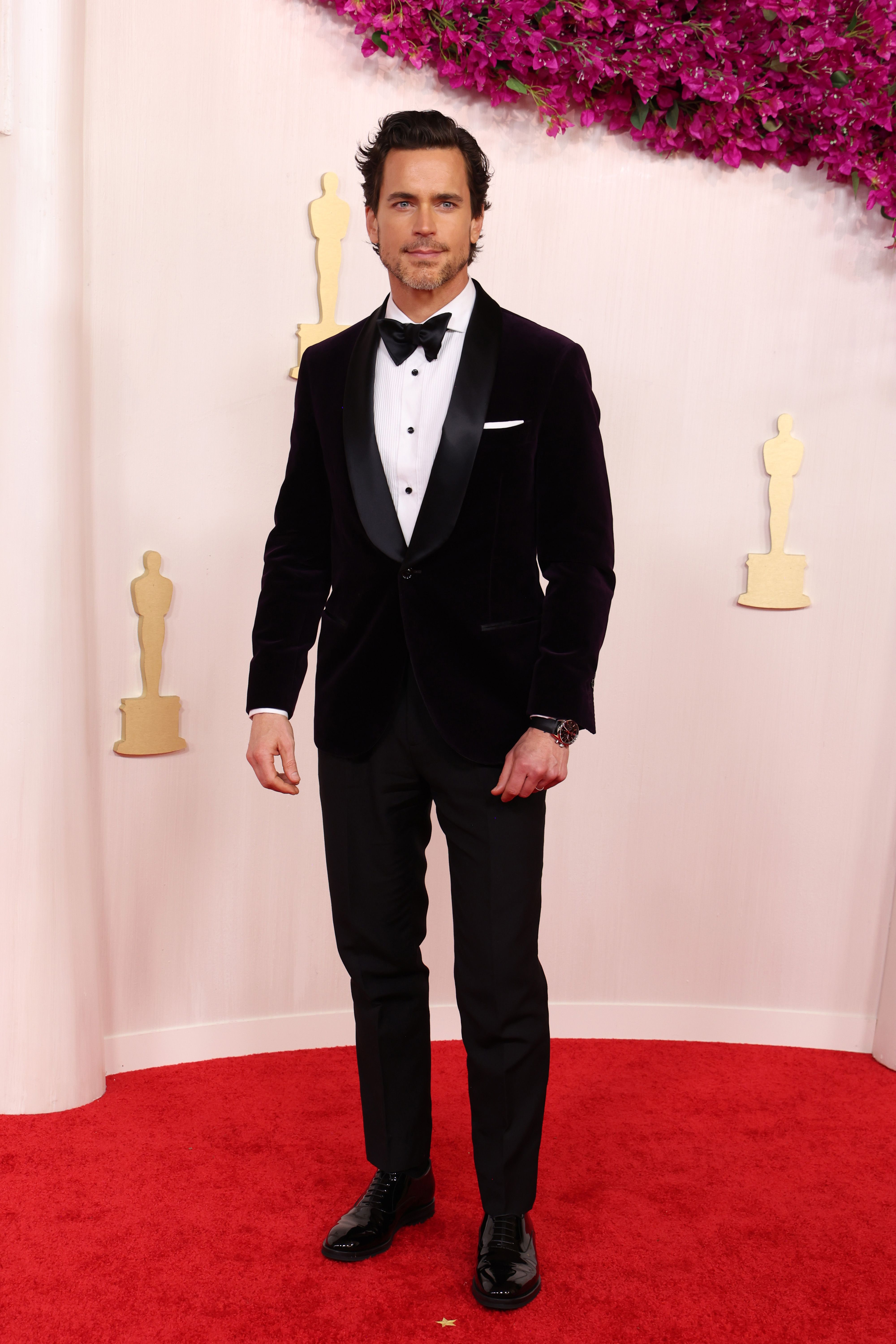 George Clooney poses on the red carpet before the screening of 