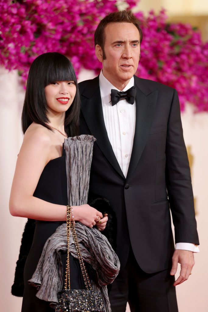 hollywood, california march 10 l r riko shibata and nicolas cage attend the 96th annual academy awards on march 10, 2024 in hollywood, california photo by mike coppolagetty images