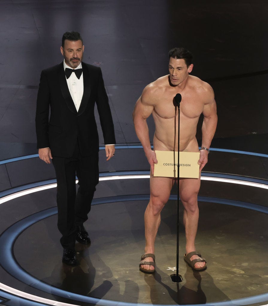 96th Annual Academy Awards - Show hollywood, california march 10 l r jimmy kimmel and john cena speak onstage during the 96th annual academy awards at dolby theatre on march 10, 2024 in hollywood, california photo by kevin wintergetty images