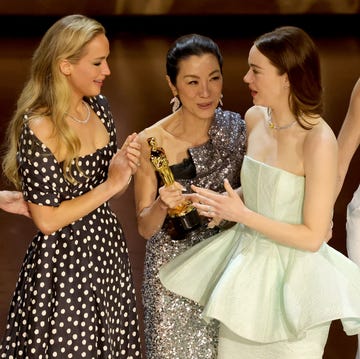 hollywood, california march 10 emma stone 2nd r accepts the best actress in a leading role award for poor things from jennifer lawrence, michelle yeoh, and charlize theron onstage during the 96th annual academy awards at dolby theatre on march 10, 2024 in hollywood, california photo by kevin wintergetty images